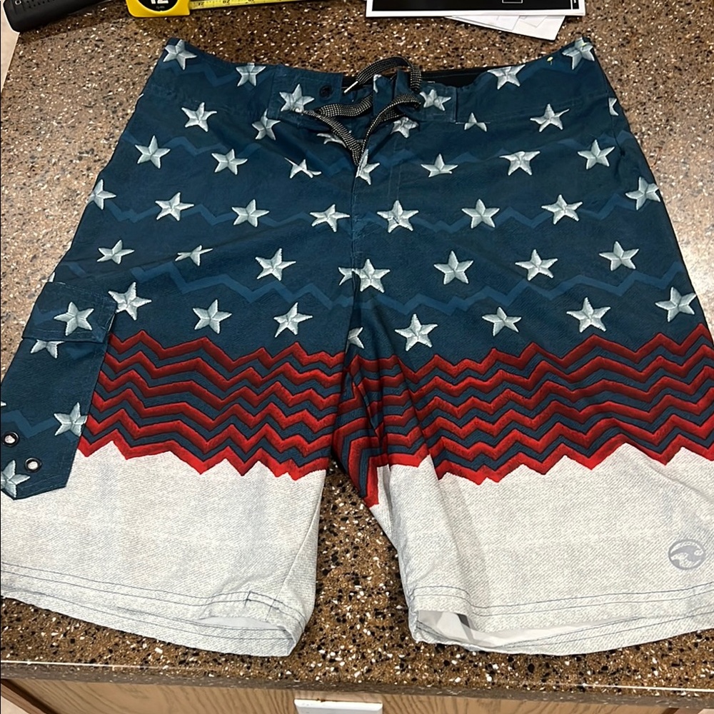 Ocean Current Blue and Red Board Shorts with Patriotic Flair